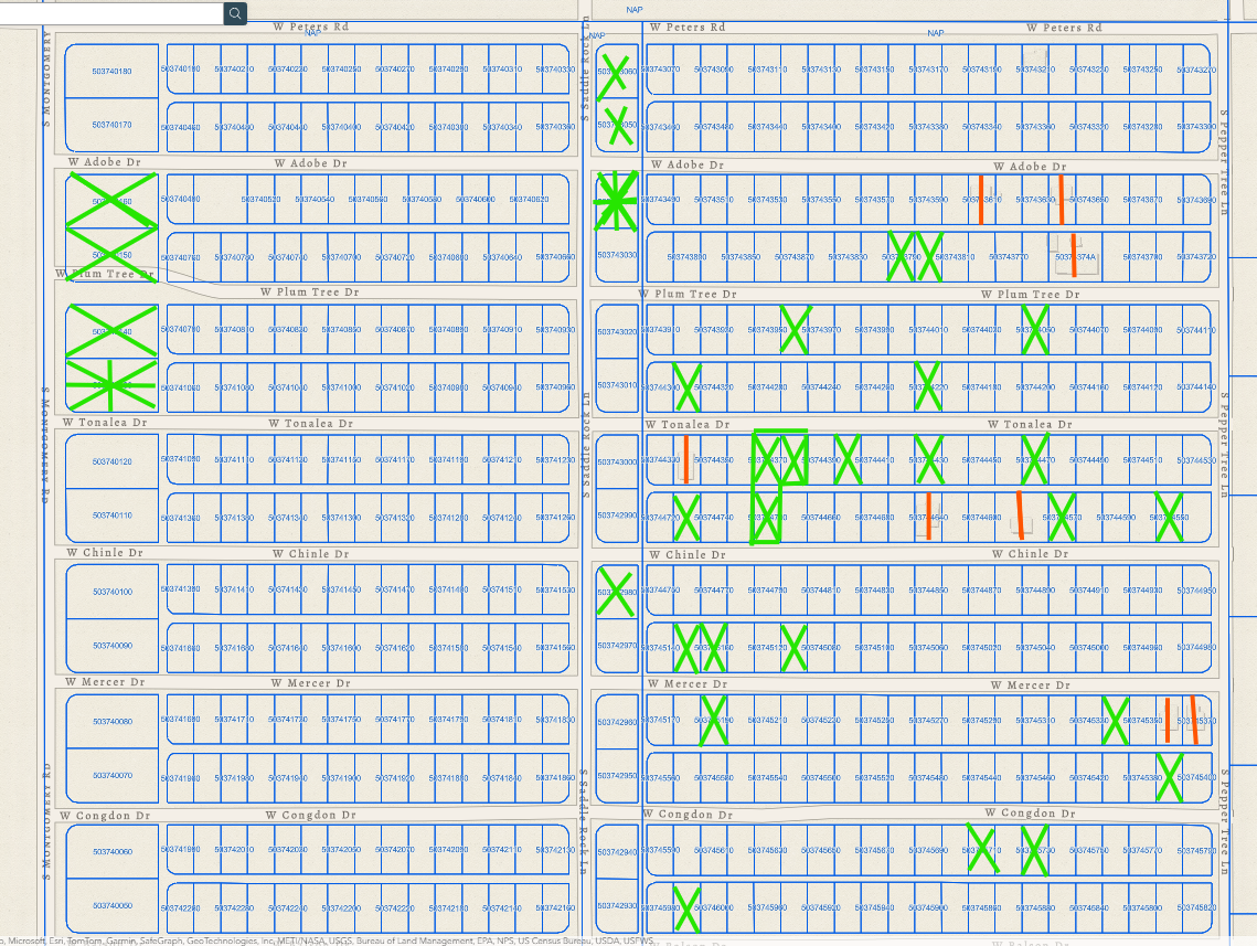 Pinal County parcel map showing the village lots with owned parcels marked in green and developed parcels marked in red.
